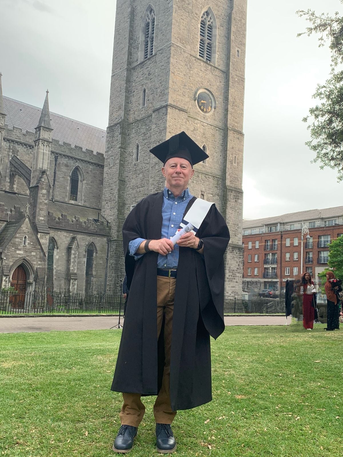 Joe in his graduation gown outside St Patrick's Cathedral
